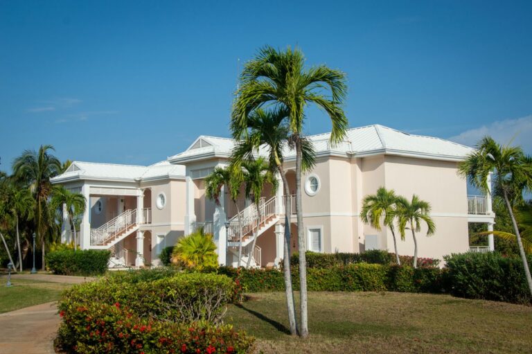 A luxurious villa amidst tropical palm trees, perfect for a serene getaway.